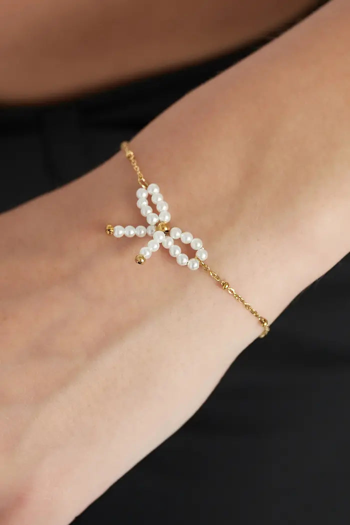 Parel strik armband witgoud