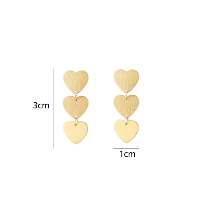 Drie hartjes oorbellen goud-
