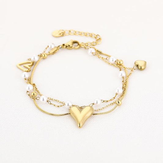 Dubbele hartjes en parels armbandje Goud
